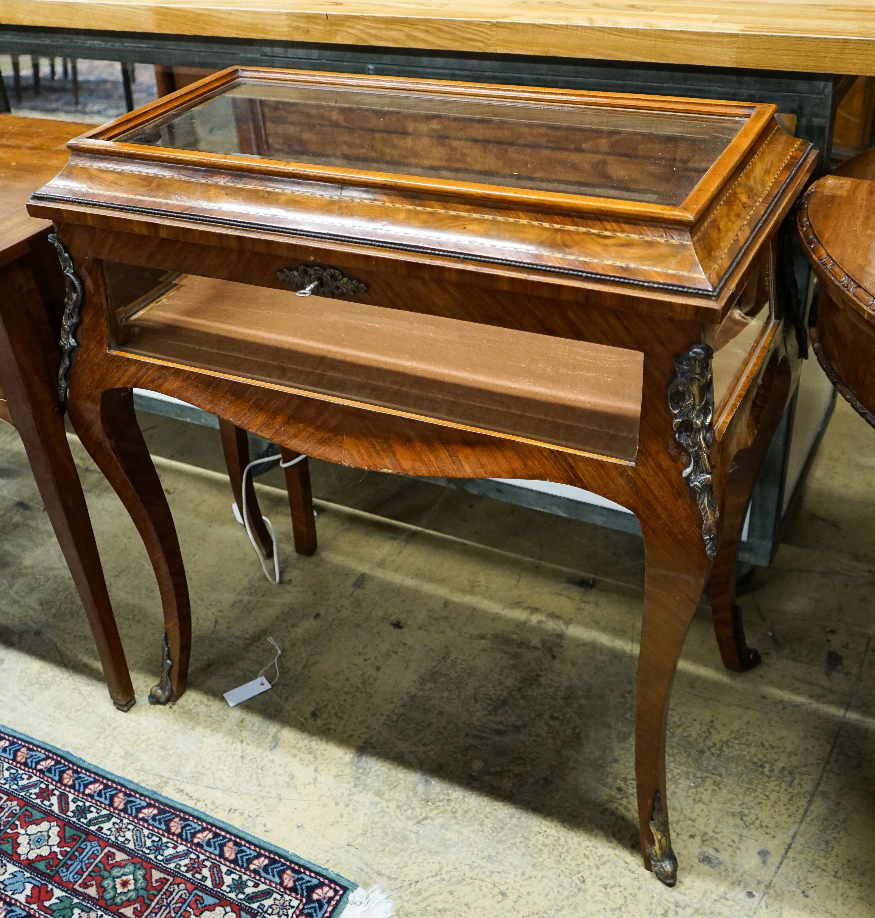 A Louis XV design gilt metal mounted kingwood and walnut bijouterie cabinet, width 82cm, depth 42cm, height 88cm